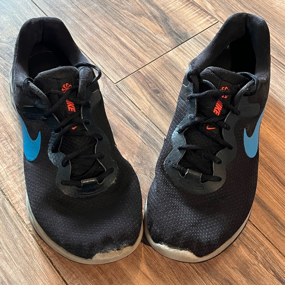 Nike Black Sneakers with Blue Swoosh and Small Orange Accents